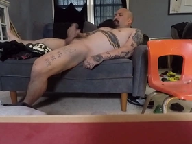 Solo boy playing with his cock on the couch