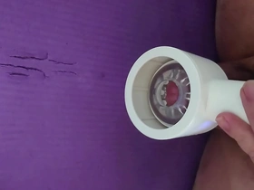 Japanese gay masturbates with a toy and climaxes.