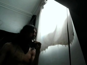 A bearded ladyboy enjoys 12 minutes of deep throat pleasure with a dildo.
