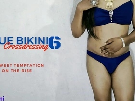 Beautiful transsexual wears blue bikini and shows off her body