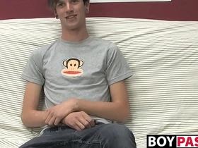 Danny, a cute gay guy, masturbates on the couch in a solo scene.