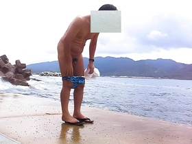 Japanese mature man caught on camera while changing clothes at the beach