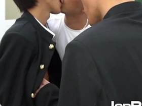 Young Japanese boy gets spitroasted by two well-endowed men