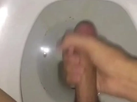 Solo boy enjoying himself in the toilet