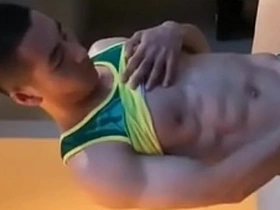Hunky jock reveals his muscular body during steamy striptease