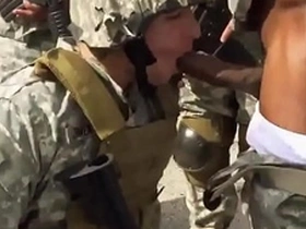 Asian and blonde soldiers in uniform engage in gay sex in military setting
