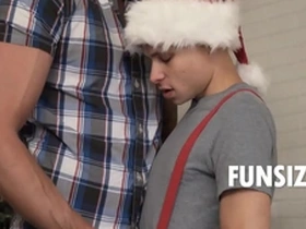 Tiny twink gets naughty with Santa's helper in steamy holiday gay porn