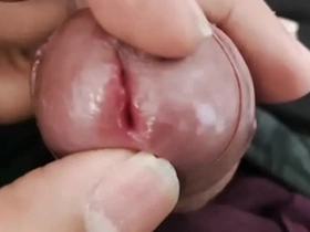 A young Asian boy shows off his small penis.