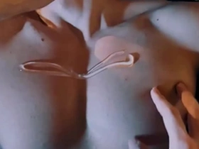 A sexy Asian man gets a massage with nipple stimulation.