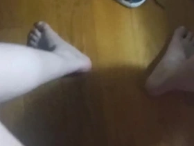 Latina beauty gives a hand job to her sister.