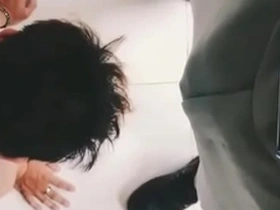 An Asian man satisfies his boss at the office and is very loyal to him.